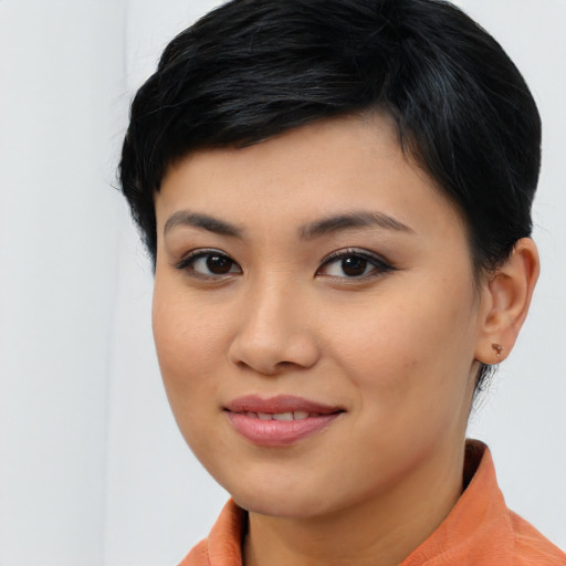 Joyful asian young-adult female with medium  black hair and brown eyes