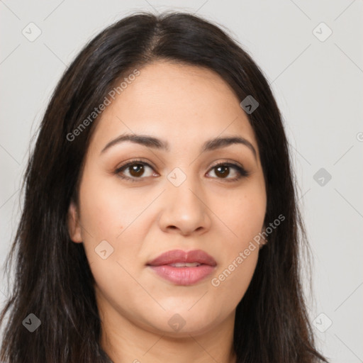 Joyful latino young-adult female with long  brown hair and brown eyes