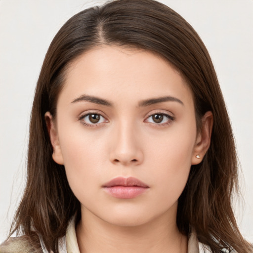 Neutral white young-adult female with long  brown hair and brown eyes