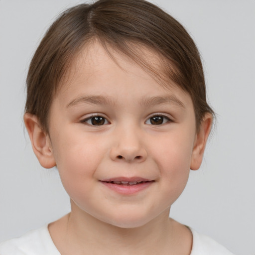 Joyful white child female with short  brown hair and brown eyes