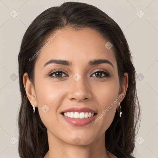 Joyful white young-adult female with long  brown hair and brown eyes