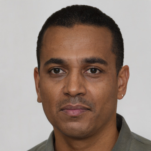 Neutral black adult male with short  black hair and brown eyes