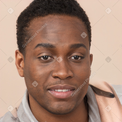 Joyful black young-adult male with short  brown hair and brown eyes