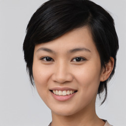 Joyful asian young-adult female with medium  black hair and brown eyes