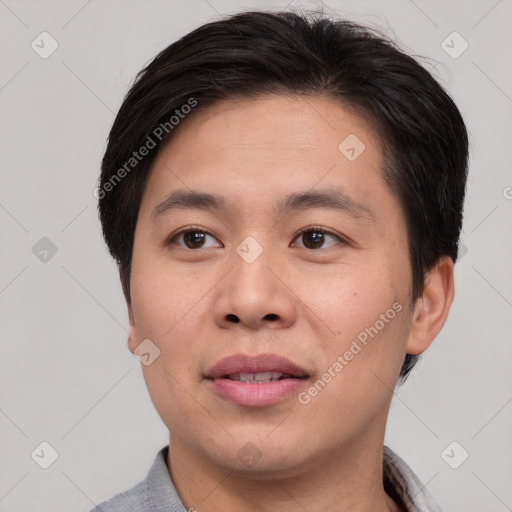 Joyful asian young-adult male with short  brown hair and brown eyes