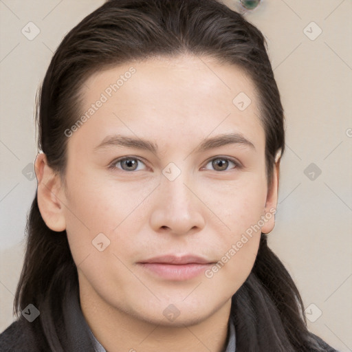 Neutral white young-adult female with long  brown hair and brown eyes