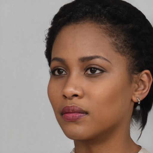 Neutral black young-adult female with short  brown hair and brown eyes