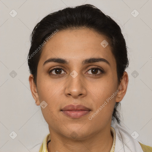 Joyful latino young-adult female with short  brown hair and brown eyes