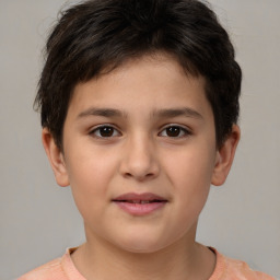 Joyful white child male with short  brown hair and brown eyes