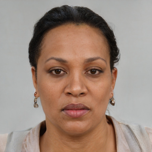 Neutral latino adult female with short  black hair and brown eyes