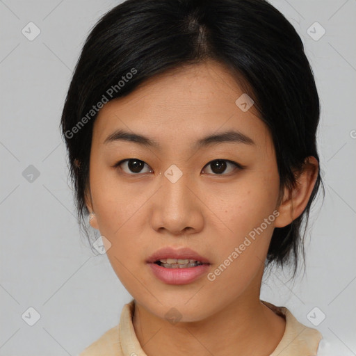 Joyful asian young-adult female with medium  black hair and brown eyes