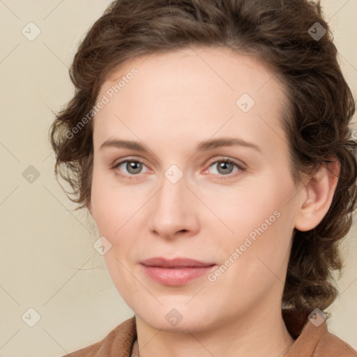 Joyful white young-adult female with medium  brown hair and green eyes