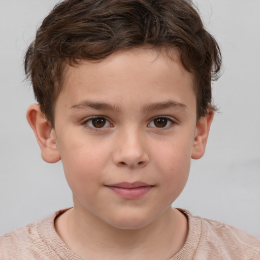 Joyful white child male with short  brown hair and brown eyes