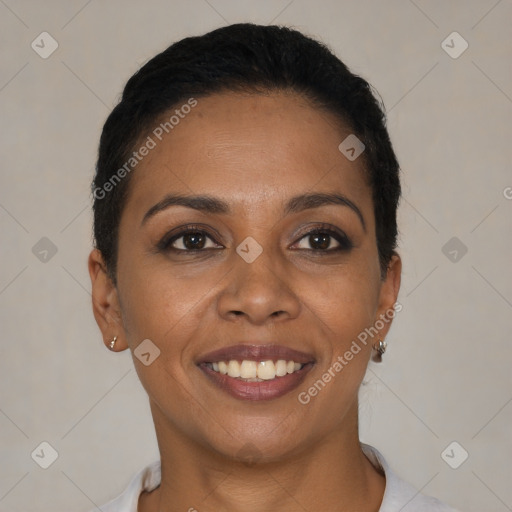 Joyful black young-adult female with short  black hair and brown eyes