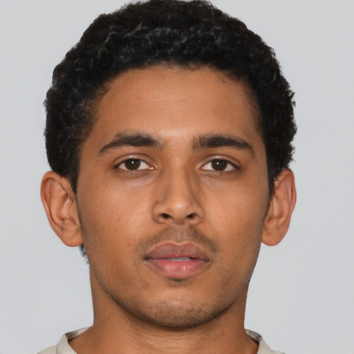 Neutral latino young-adult male with short  brown hair and brown eyes