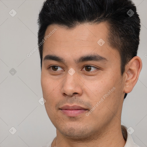 Joyful asian young-adult male with short  black hair and brown eyes