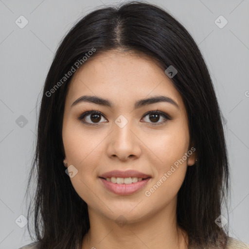 Joyful latino young-adult female with long  brown hair and brown eyes