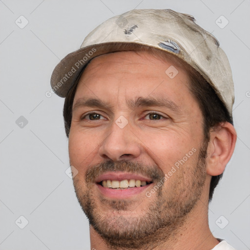 Joyful white adult male with short  black hair and brown eyes