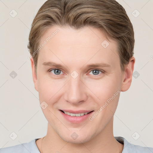 Joyful white young-adult female with short  brown hair and blue eyes