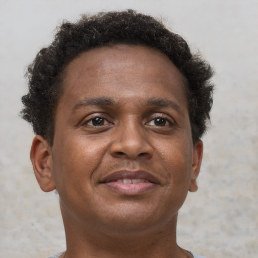 Neutral black adult male with short  brown hair and brown eyes