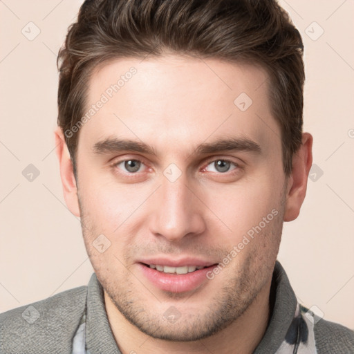 Joyful white young-adult male with short  brown hair and brown eyes