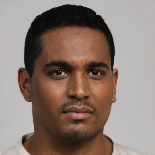 Neutral black young-adult male with short  black hair and brown eyes