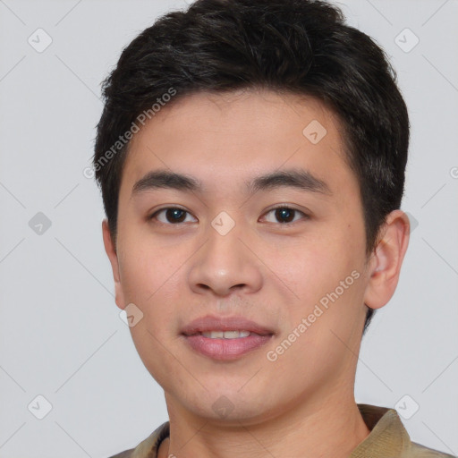 Joyful white young-adult male with short  black hair and brown eyes