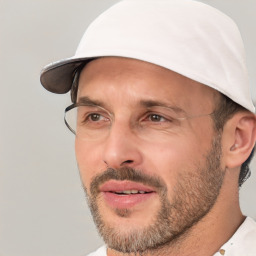 Joyful white adult male with short  black hair and brown eyes