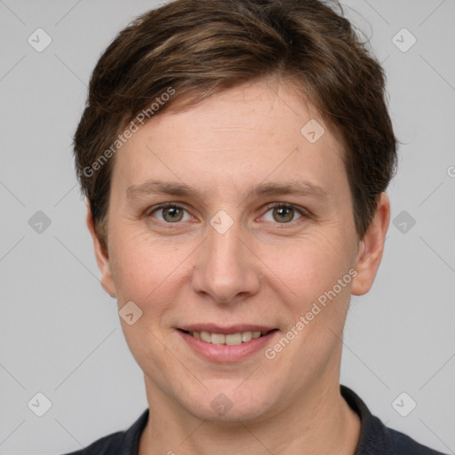 Joyful white young-adult female with short  brown hair and grey eyes