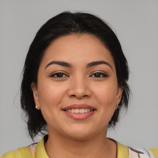 Joyful asian young-adult female with medium  brown hair and brown eyes