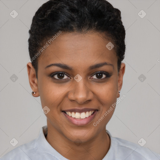 Joyful black young-adult female with short  brown hair and brown eyes