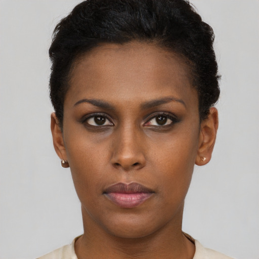 Neutral black young-adult female with short  brown hair and brown eyes