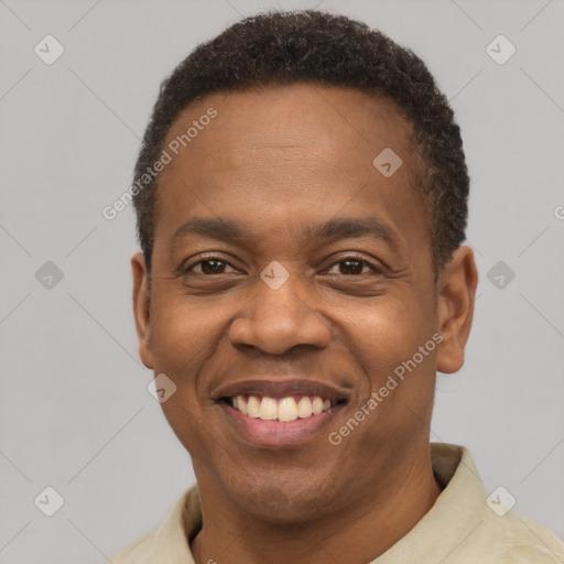 Joyful latino young-adult male with short  brown hair and brown eyes