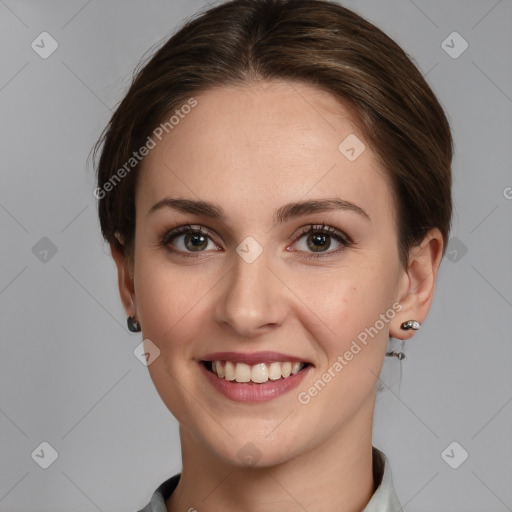 Joyful white young-adult female with medium  brown hair and grey eyes