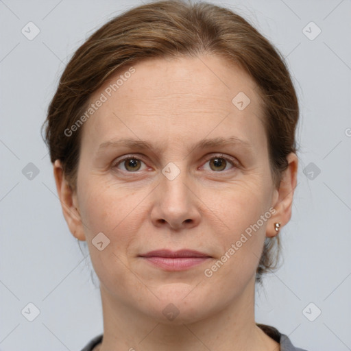 Joyful white adult female with short  brown hair and grey eyes