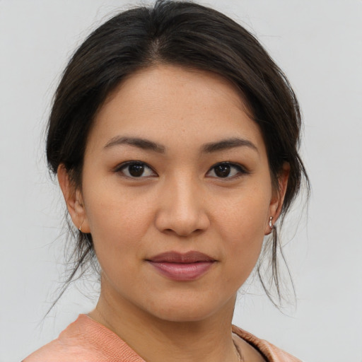 Joyful asian young-adult female with medium  brown hair and brown eyes