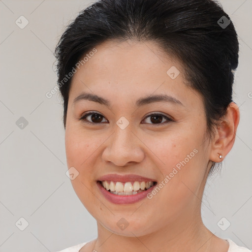 Joyful white young-adult female with medium  brown hair and brown eyes