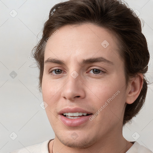 Joyful white young-adult female with short  brown hair and grey eyes