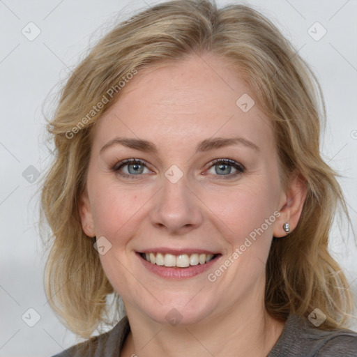 Joyful white adult female with medium  brown hair and blue eyes