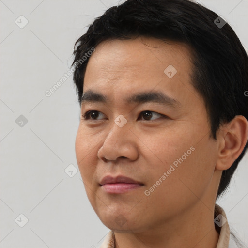 Neutral asian young-adult male with short  black hair and brown eyes