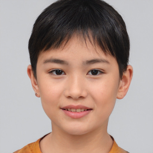 Joyful asian child female with short  brown hair and brown eyes