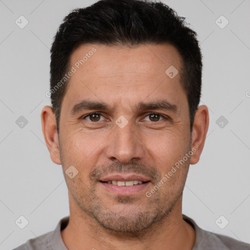 Joyful white adult male with short  brown hair and brown eyes