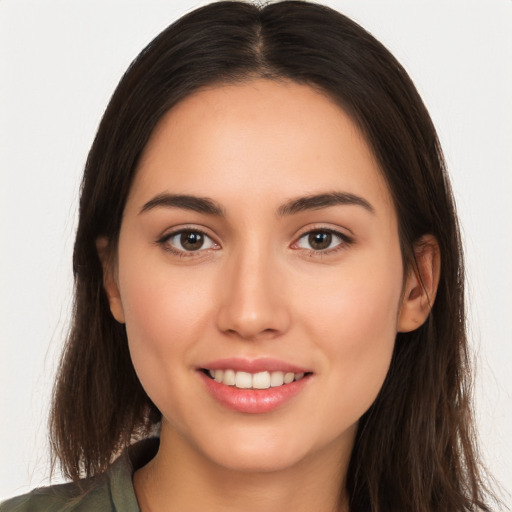 Joyful white young-adult female with long  brown hair and brown eyes