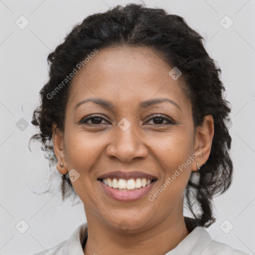 Joyful latino adult female with medium  brown hair and brown eyes