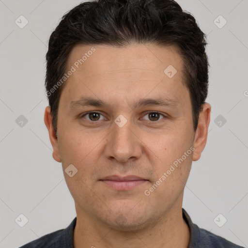 Joyful white adult male with short  brown hair and brown eyes