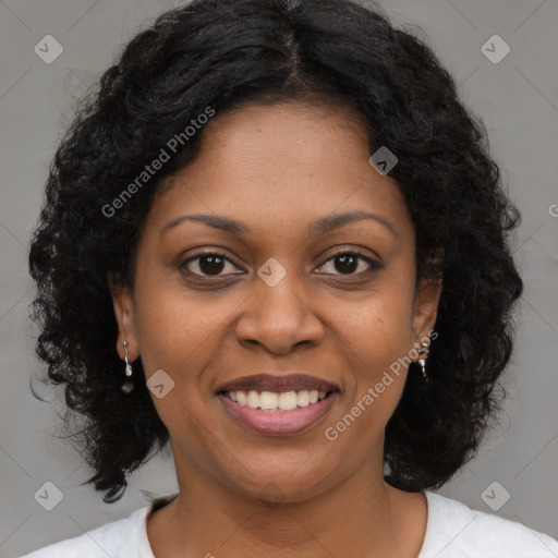 Joyful black young-adult female with medium  brown hair and brown eyes