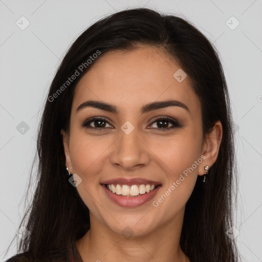 Joyful latino young-adult female with long  brown hair and brown eyes