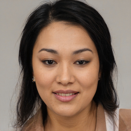 Joyful asian young-adult female with medium  brown hair and brown eyes