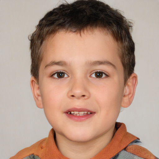 Joyful white child male with short  brown hair and brown eyes