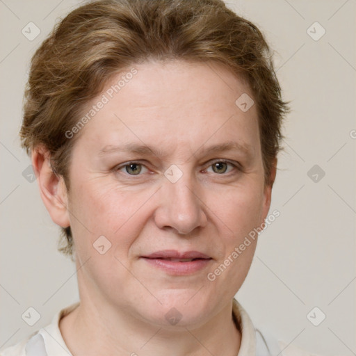 Joyful white adult female with short  brown hair and grey eyes